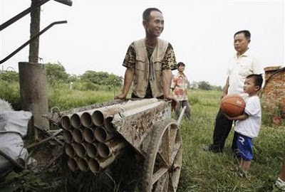 Chinese farmer defends his property