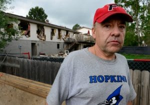 Leo Lech at the back of his destroyed house in Greenwood Village.